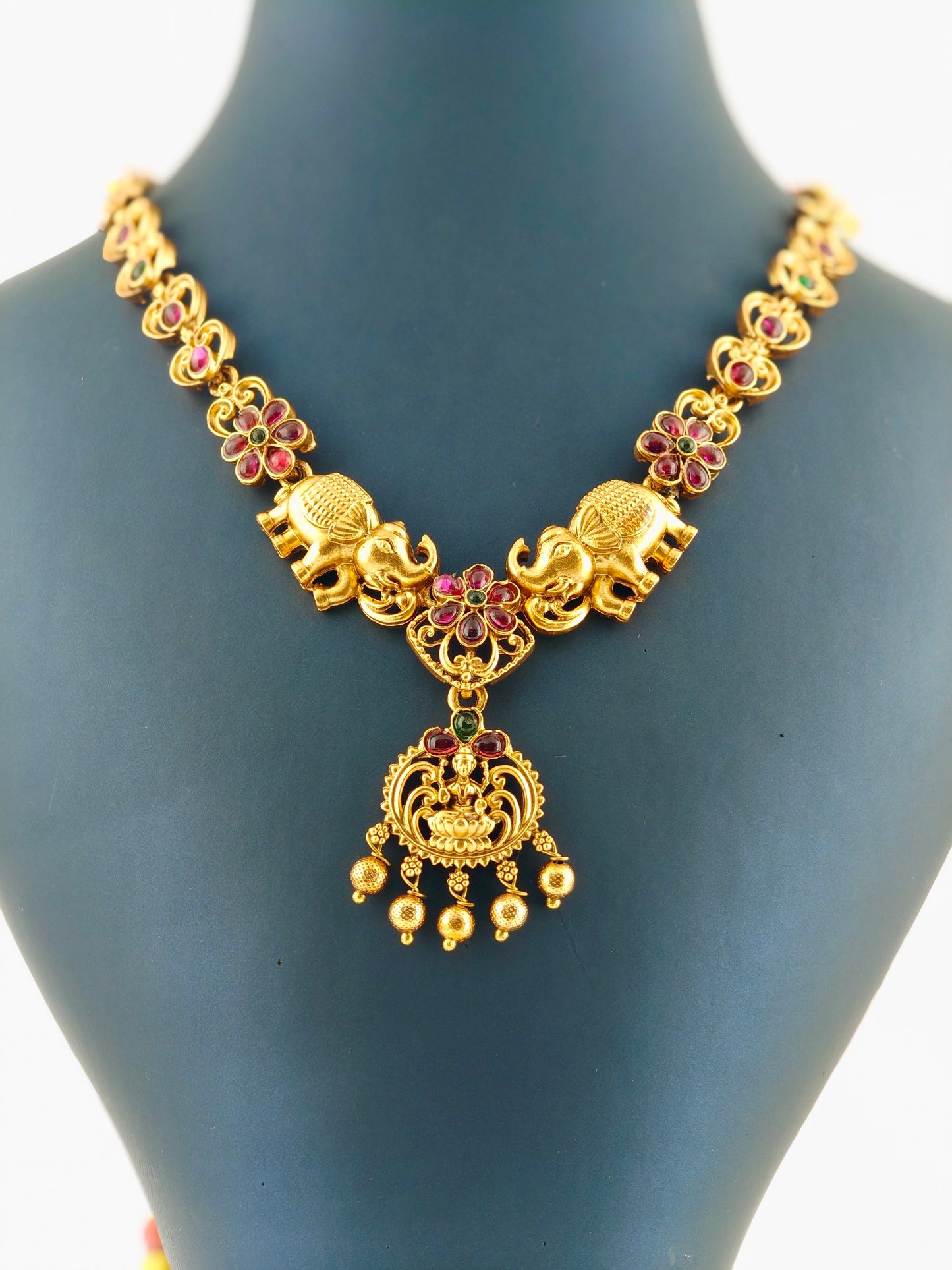 Elephant necklace with ruby and green