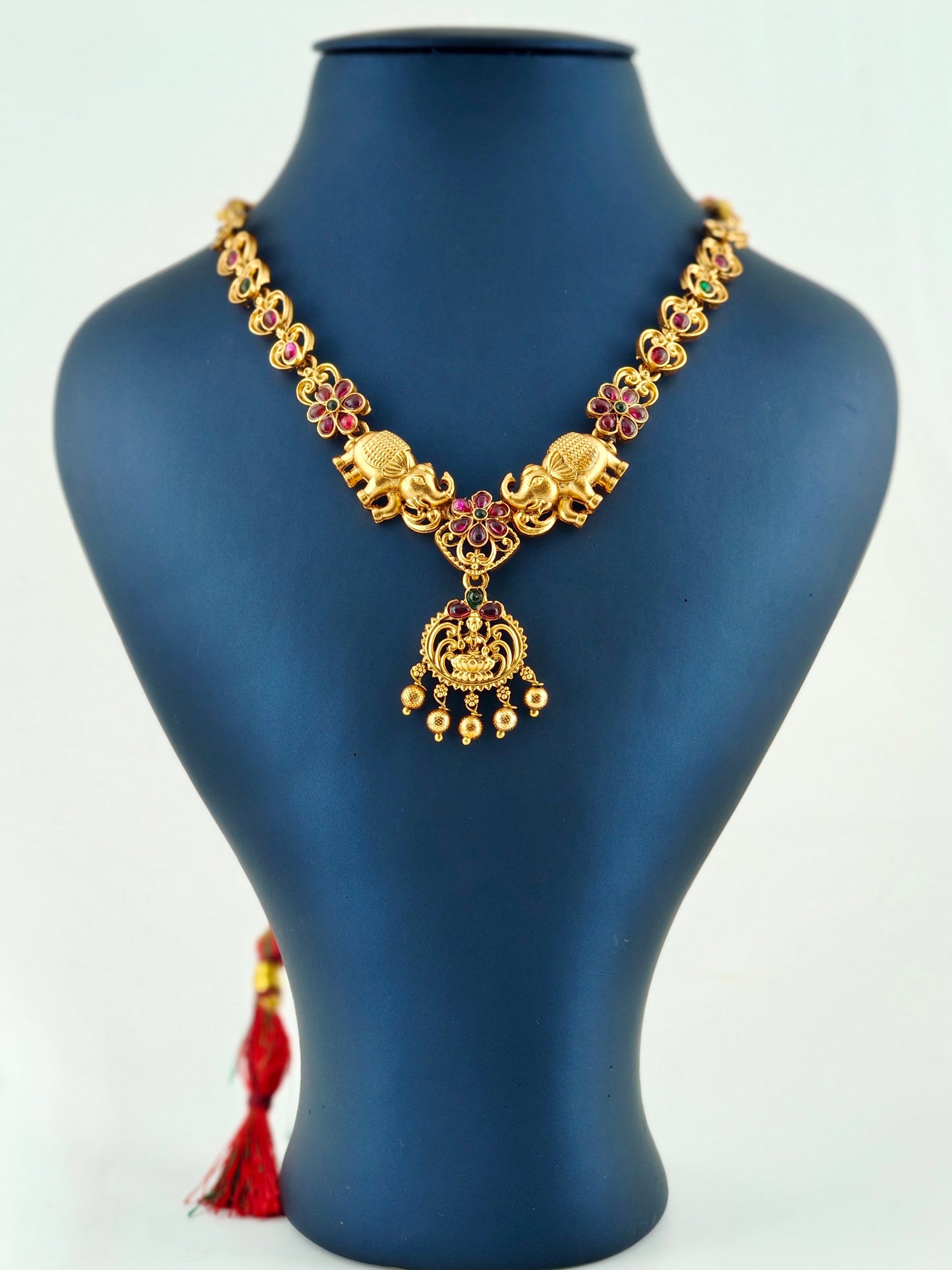 Elephant necklace with ruby and green